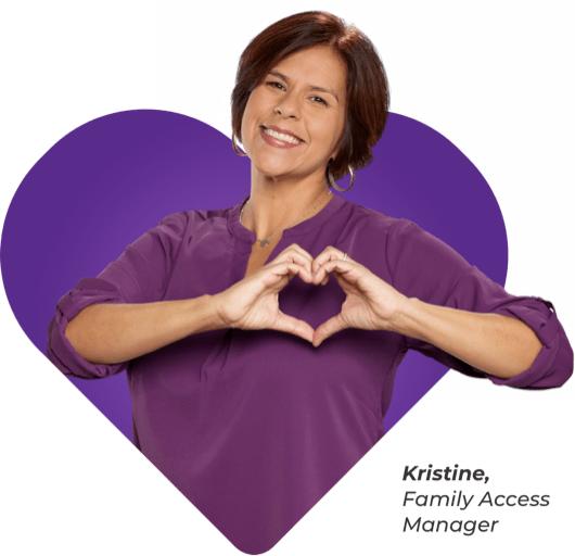 Kristine with hands over heart in shape of heart