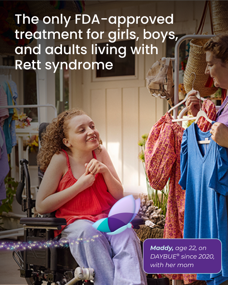 Maddy, age 20, living with Rett syndrome, with her mom. The light makes a circle around Maddy.