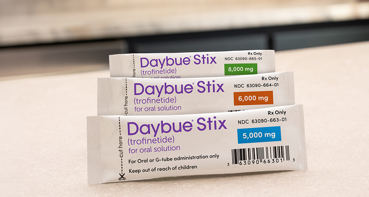 Ellie, age 15, living with Rett syndrome, with her parents mobile